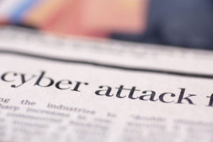 Cyber attack written newspaper. Cyber attack written newspaper, shallow dof, real newspaper.
