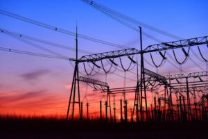 High voltage power grid under the setting sun