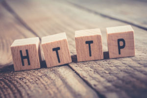 Closeup Of The Word HTTP Formed By Wooden Blocks On A Wooden Floor