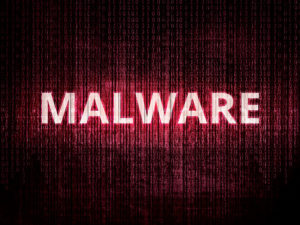 Text malware on background with binary encoding in red. Concept of invasion of privacy, hacker attack, computer attack by virus, ransomware, malware or spyware.