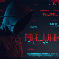 Malware concept with faceless hooded male person, low key red and blue lit image and digital glitch effect