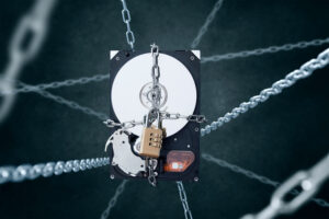 Chained hard disc drive with combination padlock. Conception of data security