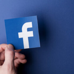Facebook logo printed onto paper. Facebook is a popular social media service founded in 2004